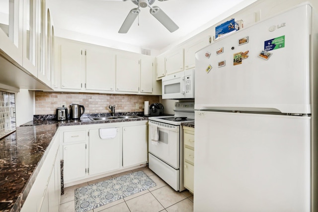 kitchen featuring light tile patterned flooring, sink, white cabinetry, white appliances, and decorative backsplash