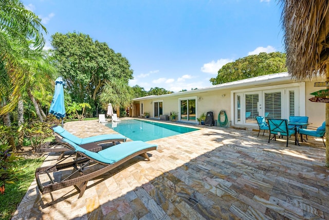 view of swimming pool with a patio