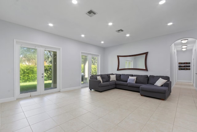 tiled living room with french doors