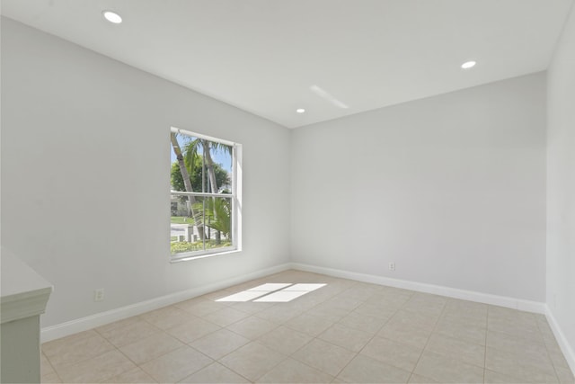 unfurnished room featuring light tile patterned floors