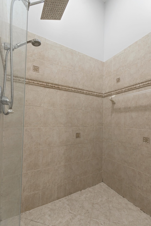 bathroom with a tile shower