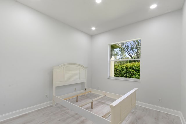 bedroom with light hardwood / wood-style floors