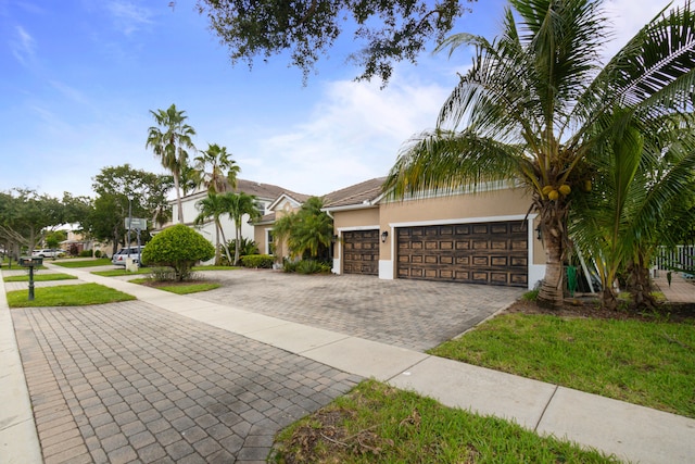 view of front of house with a front lawn and a garage