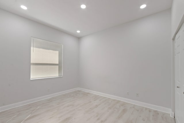 spare room with light hardwood / wood-style floors