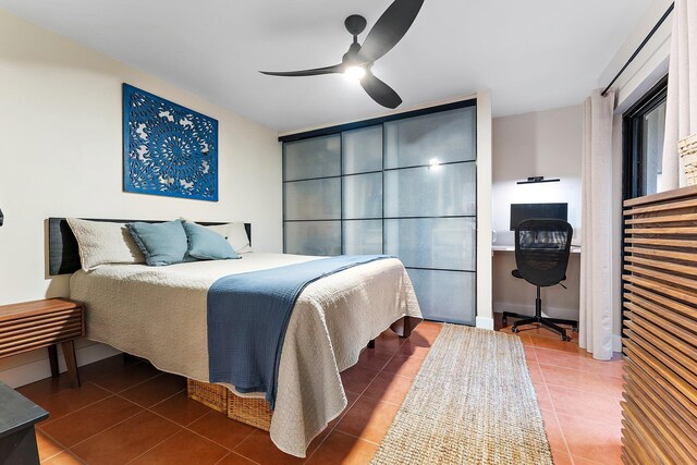 tiled bedroom with ceiling fan