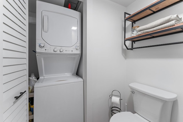 washroom with stacked washer and clothes dryer