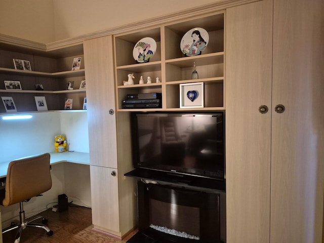office space featuring built in desk and dark wood-style flooring