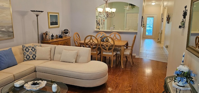 living room featuring a chandelier and hardwood / wood-style floors