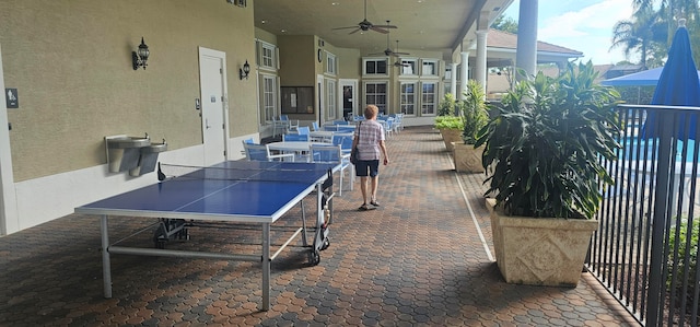 view of patio with ceiling fan