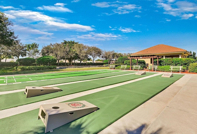 view of home's community featuring shuffleboard