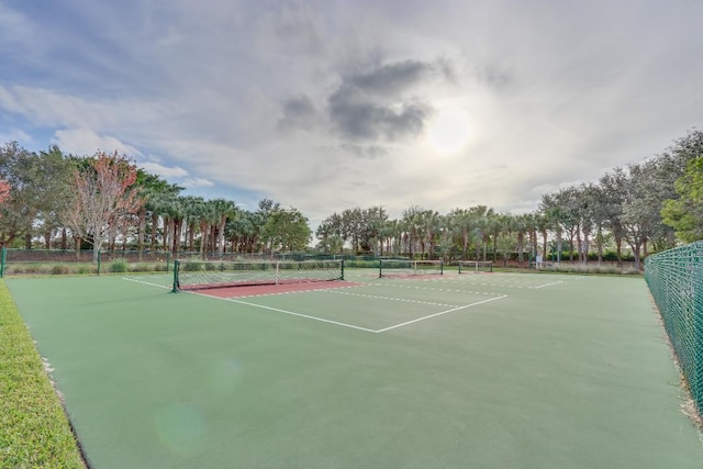 view of tennis court with fence