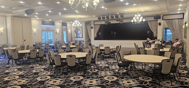 dining space with a decorative wall, ornamental molding, recessed lighting, an inviting chandelier, and a tray ceiling