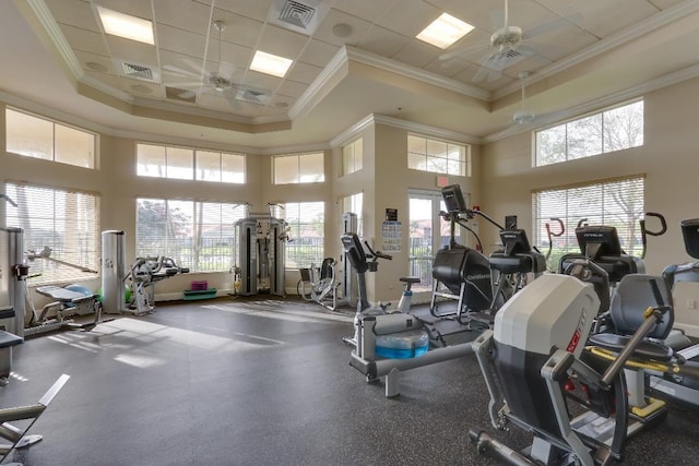 workout area featuring crown molding, a ceiling fan, and visible vents
