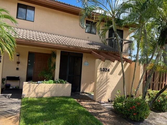 5324 Fountains Dr S, Lake Worth, FL 33467 - doorway to property with a tile roof and stucco siding