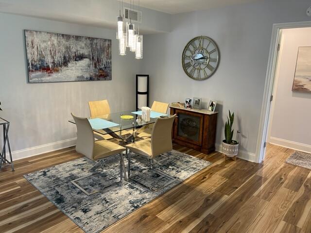 dining area featuring dark hardwood / wood-style flooring