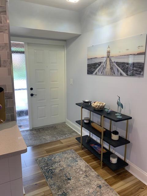 foyer entrance featuring hardwood / wood-style floors