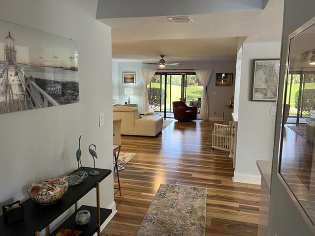 5324 Fountains Dr S, Lake Worth, FL 33467 - corridor featuring baseboards, wood finished floors, and visible vents