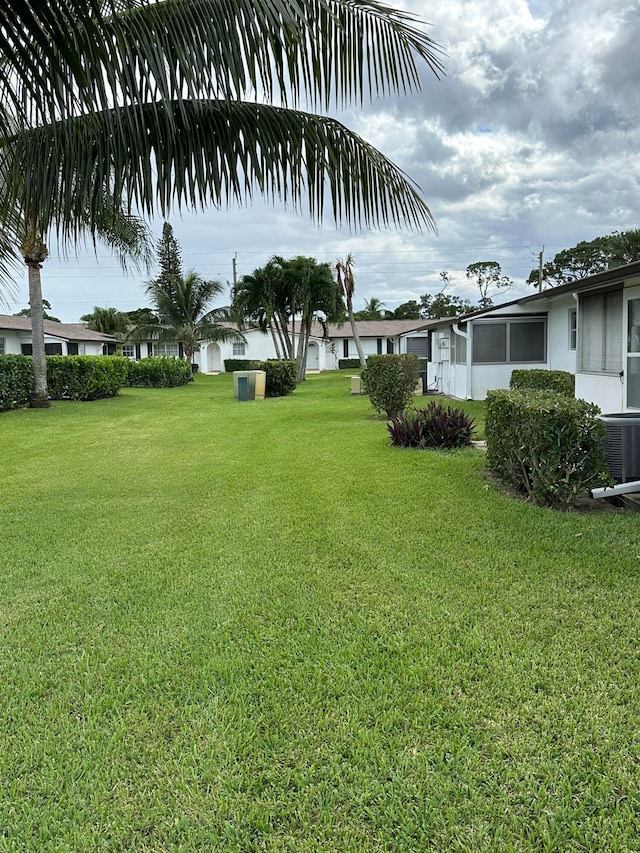 view of yard with central air condition unit