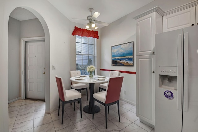 dining area with ceiling fan