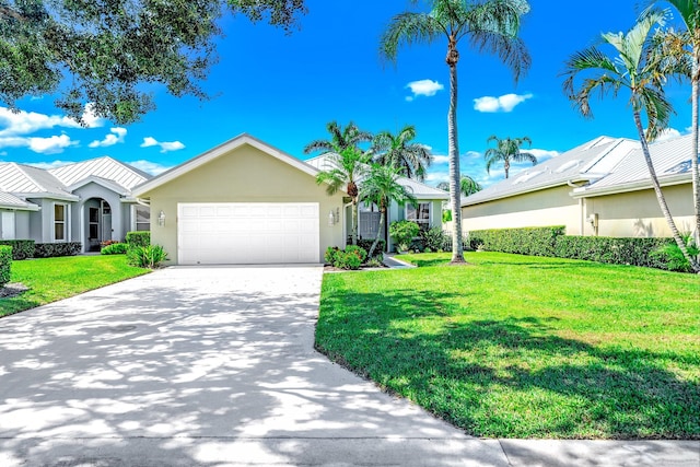 single story home featuring a front lawn and a garage