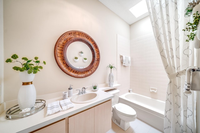 full bathroom featuring a skylight, vanity, tile patterned flooring, shower / tub combo, and toilet