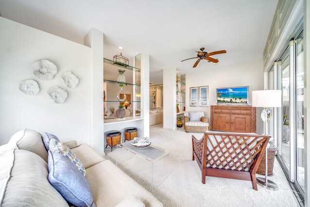 living room featuring ceiling fan and light colored carpet