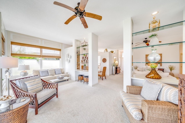 living room featuring light carpet and ceiling fan