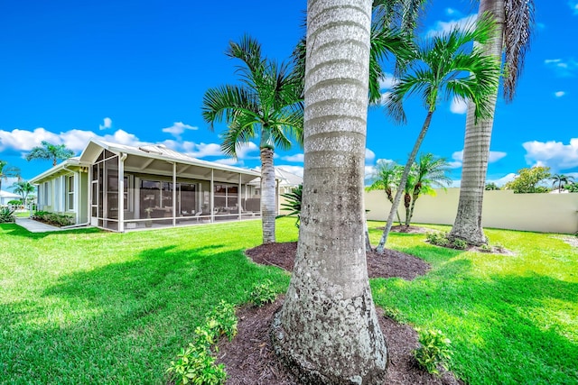 view of yard with a sunroom