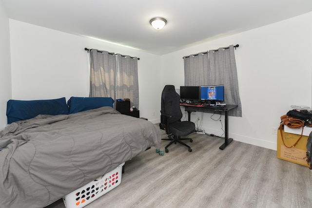 bedroom with light hardwood / wood-style flooring