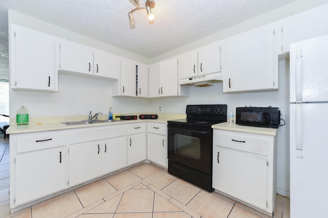 kitchen with a textured ceiling, light tile patterned flooring, sink, white cabinets, and black appliances