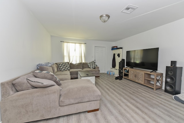 living room with light hardwood / wood-style floors