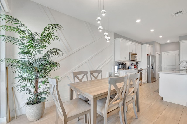 dining room featuring sink