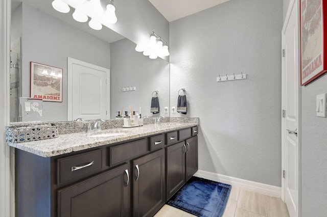 bathroom featuring vanity and tile patterned flooring