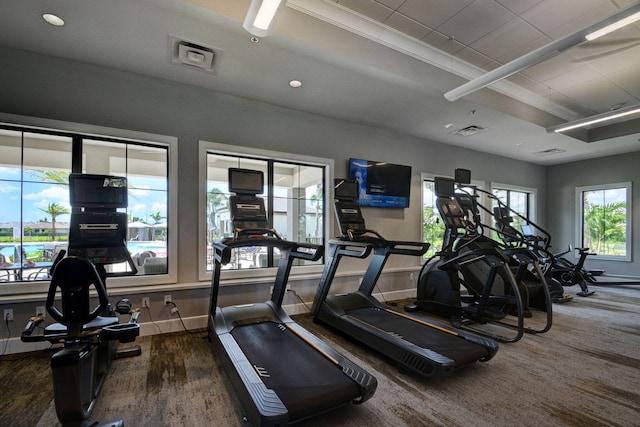 exercise room featuring dark wood-type flooring