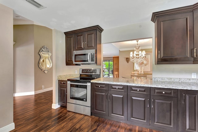 kitchen featuring appliances with stainless steel finishes, ornamental molding, dark brown cabinets, and dark wood-type flooring