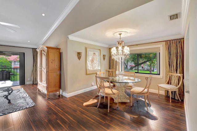 dining room featuring crown molding, dark hardwood / wood-style flooring, and a notable chandelier