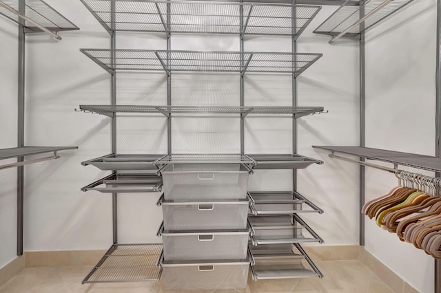 walk in closet featuring light tile patterned floors