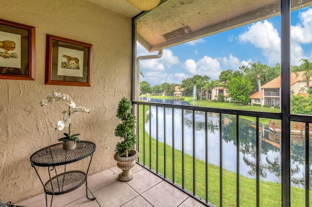 balcony featuring a water view