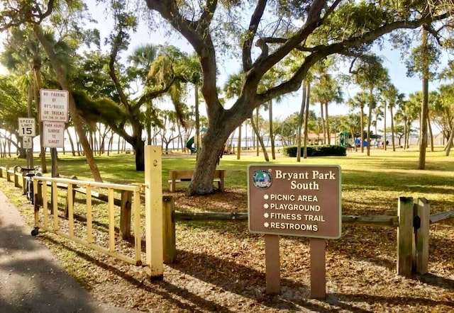 view of property's community with a playground and a yard