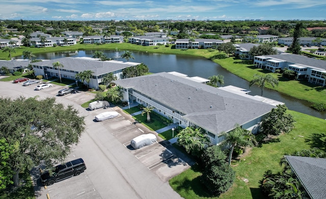 drone / aerial view with a water view