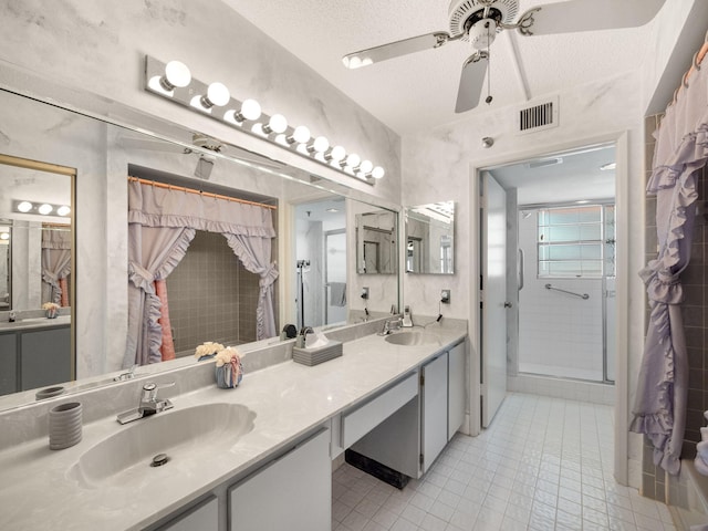 bathroom featuring ceiling fan, a textured ceiling, walk in shower, vanity, and tile patterned floors