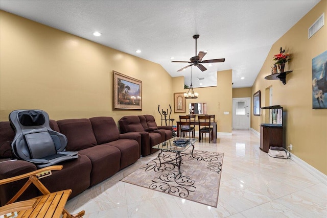 living room with a textured ceiling, ceiling fan with notable chandelier, and vaulted ceiling