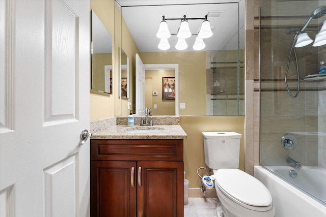 full bathroom featuring shower / bath combination with glass door, vanity, and toilet