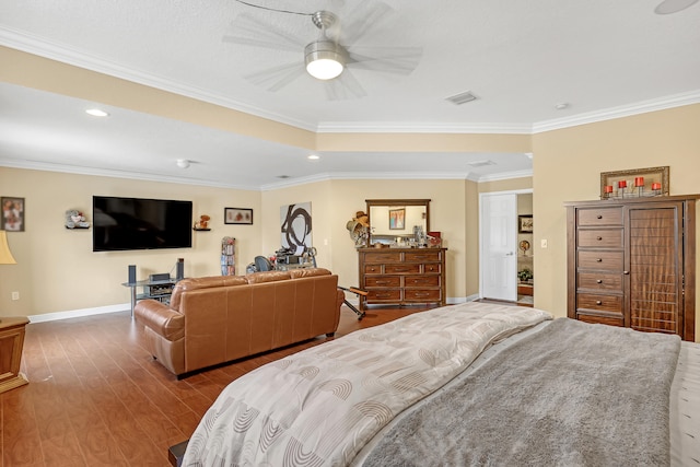 bedroom with ceiling fan, hardwood / wood-style flooring, and ornamental molding