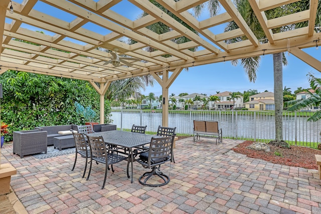 view of patio / terrace featuring a water view, a pergola, ceiling fan, and outdoor lounge area