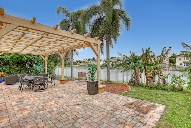 view of patio featuring a water view and a pergola