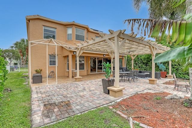 rear view of property with a pergola, a patio area, and an outdoor living space