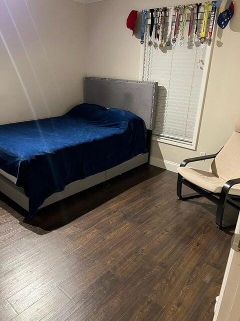 bedroom with hardwood / wood-style flooring