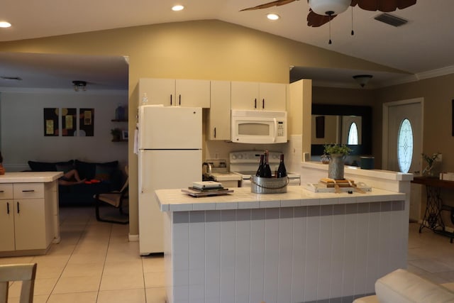 kitchen featuring kitchen peninsula, white appliances, vaulted ceiling, light tile patterned floors, and white cabinetry