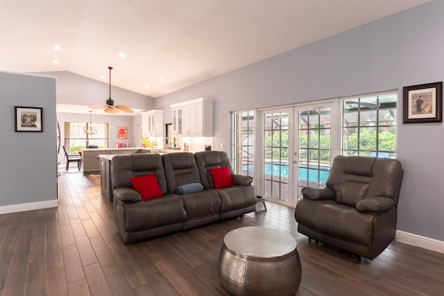 living room featuring ceiling fan, vaulted ceiling, and dark hardwood / wood-style flooring